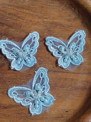 Motýl s perlami 38x43 mm světle modrý