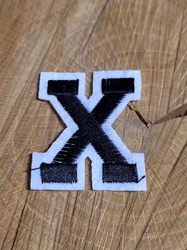 Nažehlovačka písmeno X